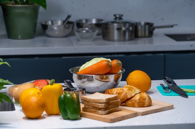 vegetable and a loaf of bread in the kitchen