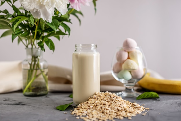 Vegetable natural oat milk on the table.