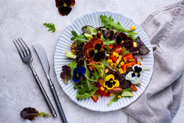 Vegetable salad with edible flowers