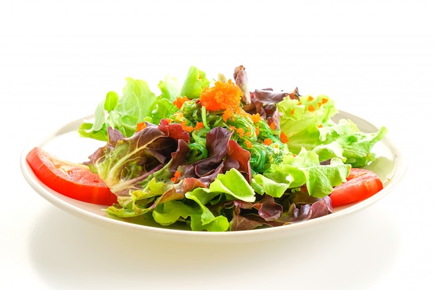 vegetable salad with Japanese seaweed and shrimp eggs on white background