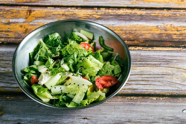 Vegetable salad on wooden table Healthy food