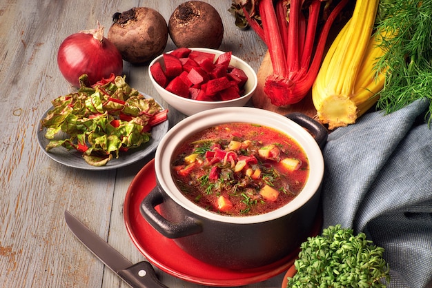 vegetable soup with beet root and fresh leaves