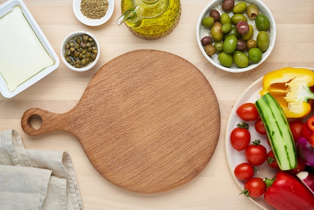 Vegetables cutting board greek salad horiatiki top view copy space menu recipe mock up