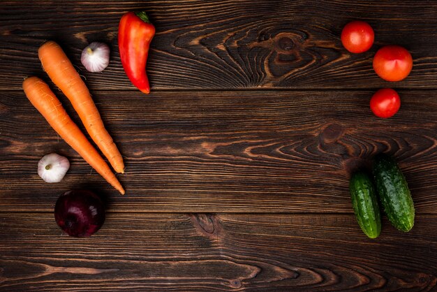 Vegetables on dark wooden.