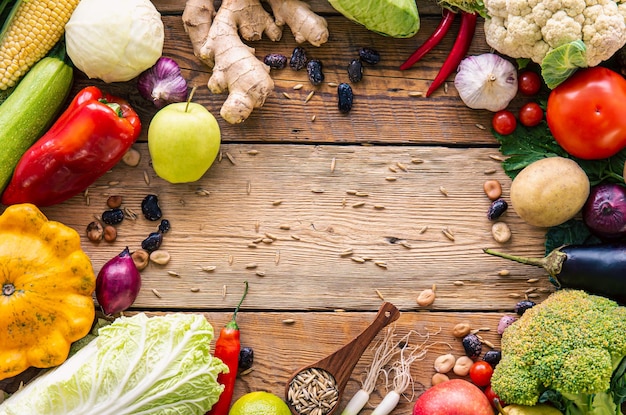 Vegetables frame on wooden background flat lay composition