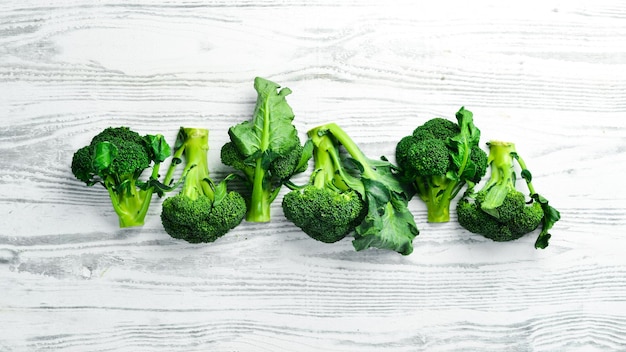 Vegetables Fresh green broccoli on a white wooden background Rustic style Top view