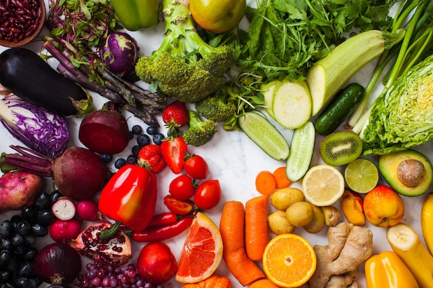 Vegetables, fruits and berries rainbow top view. Natural vitamins and antioxidants food concept.