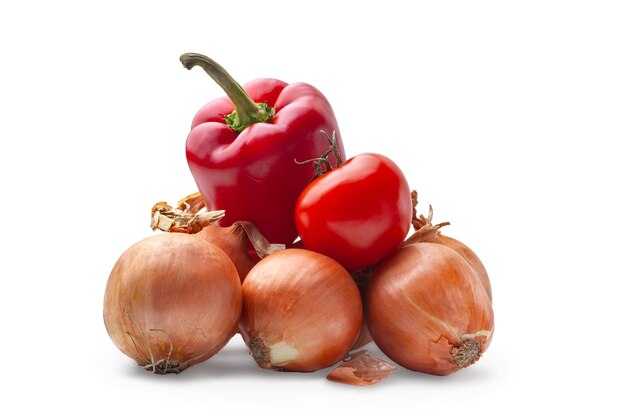 Vegetables isolated on white background Heap of ripe onion tomato and pepper on white