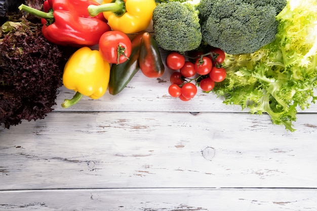 Vegetables on old light wooden table