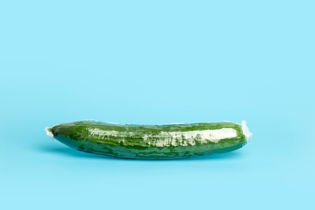 Vegetables in plastic packaging from the supermarket are minimal cucumber in cellophane and nondegra...