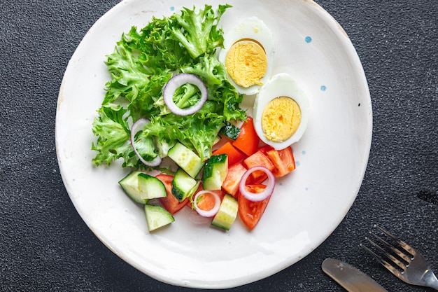 Vegetables salad with egg healthy meal diet snack on the table copy space food background