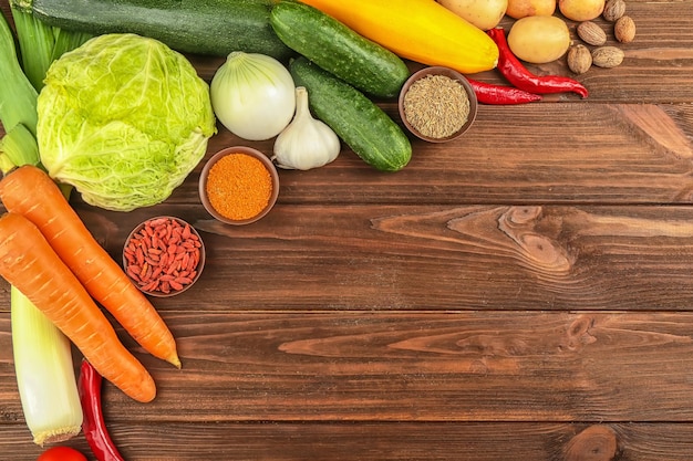 Vegetables and spices on wooden table