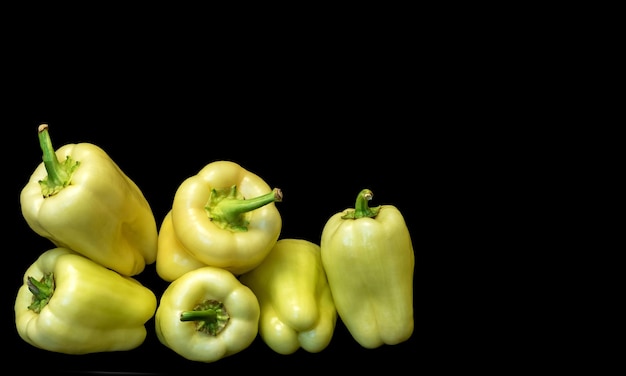 Vegetables sweet peppers on black backgroundxA