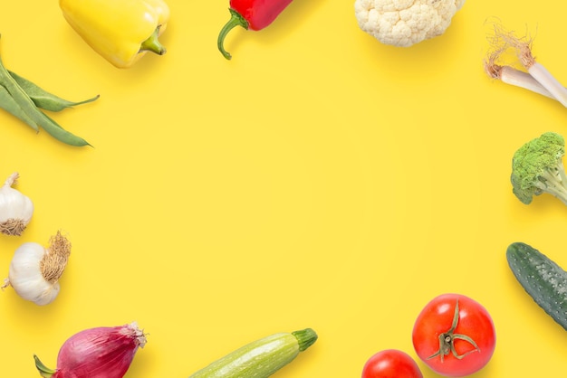 Vegetables on yellow surface Creative scene for vegetarian cuisine promotion Copy space in the middle