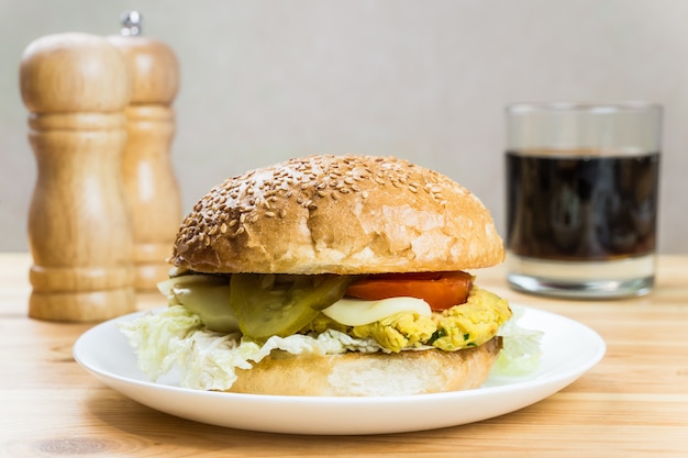 Vegetarian burger served on a white plate