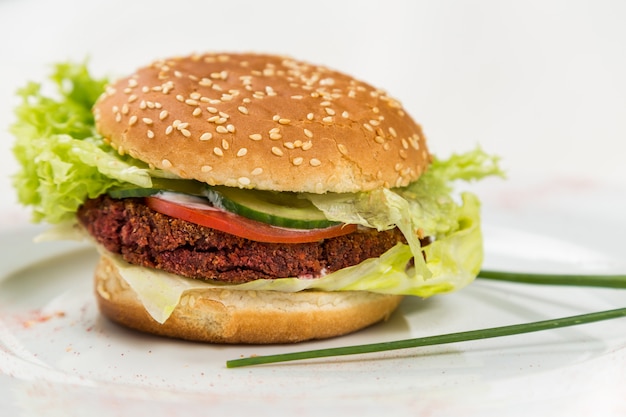 Vegetarian burger with vegetables and cutlet