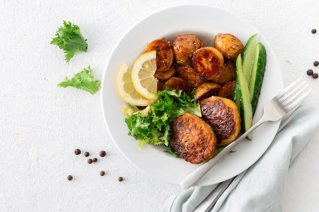 Vegetarian cutlets with new potatoes and salad