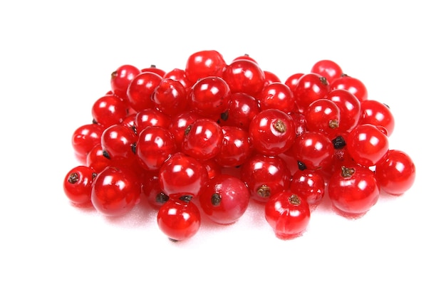 Vegetarian food concept Lots of sweet juicy red currants isolated on white background Closeup red berries