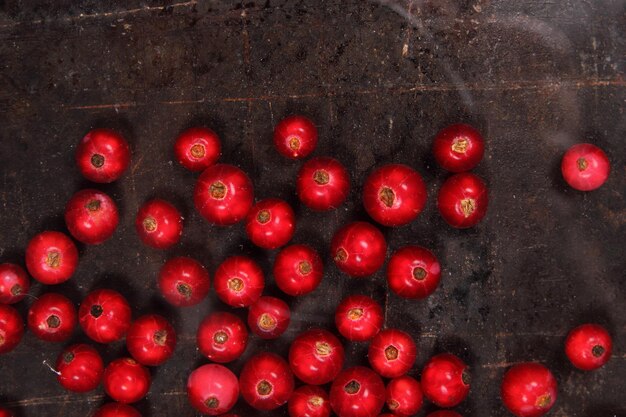 Vegetarian food concept Sweet juicy red currants on a dark background View from above Closeup