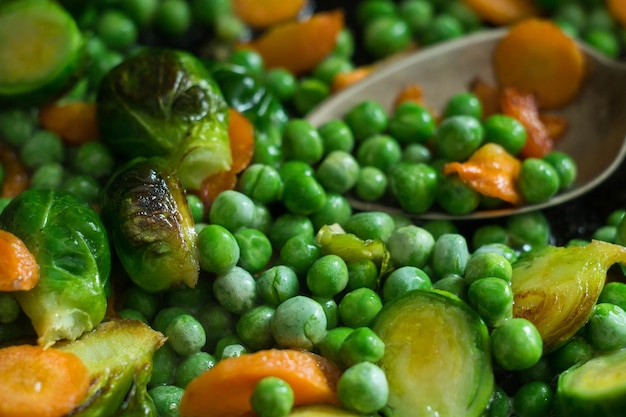 Vegetarian food from fried vegetables, brussels sprouts and carrots