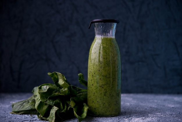 Vegetarian green smoothie and mint leaves