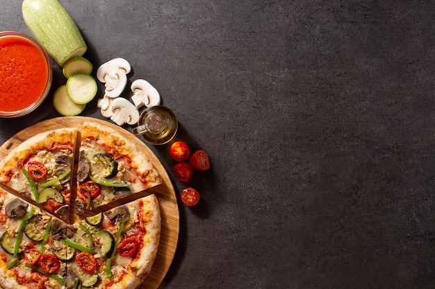 Vegetarian pizza with zucchini tomato peppers and mushrooms