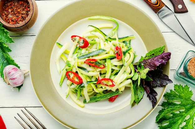 Vegetarian salad with fresh zucchini, peppers and garlic.