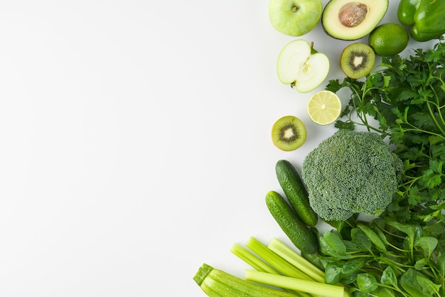 Vegetarian set of broccoli celery cucumber pepper apple kiwi lime parsley spinach zucchini