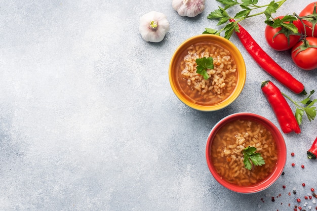 Vegetarian soup kharcho with rice and vegetables.