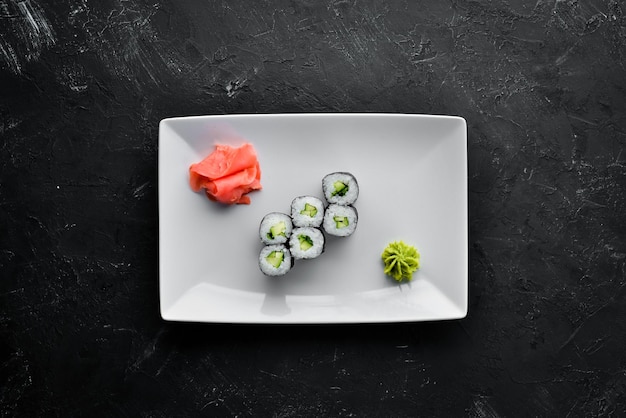 Vegetarian sushi roll with cucumber Japanese cuisine Top view