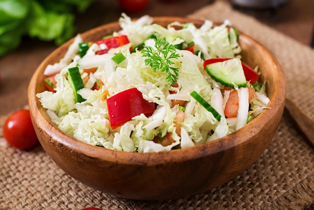 Vegetarian vegetable salad in a wooden bowl