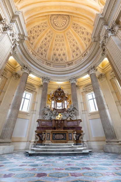 VENARIA REALE, ITALY - CIRCA MAY 2021: sacred catholic altar in Baroque style and cupola. Day light.