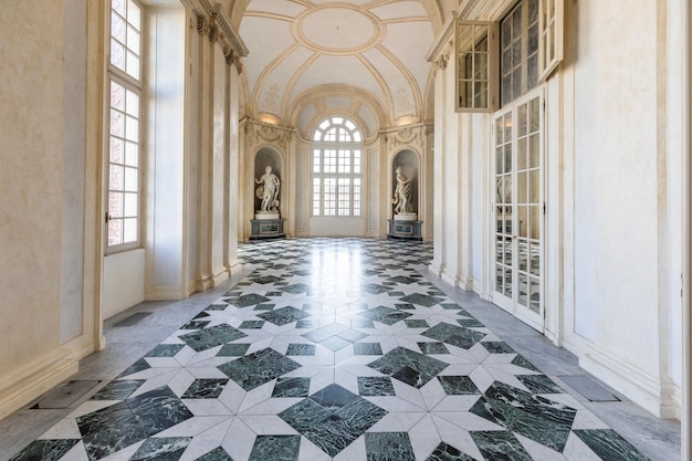 Venaria Reale Italy January 2023 luxury interior old royal palace Gallery perspective with window