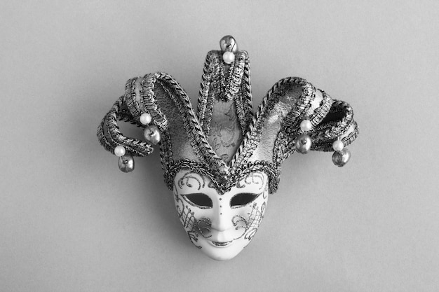 Venetian carnival mask in the center of the gray background Top view Copy space