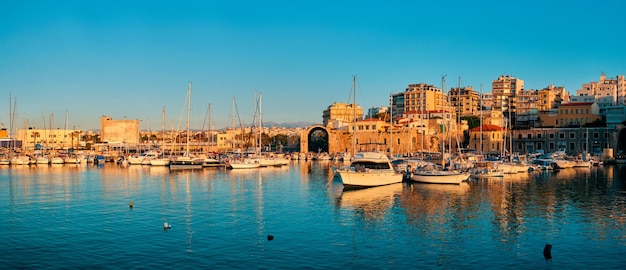 Venetian Fort in Heraklion and moored fishing boats Crete Island Greece