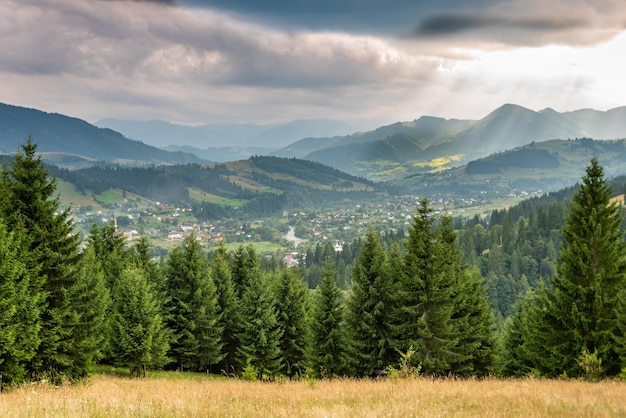 Verkhovyna village in Carpathian mountains in warm sunset light