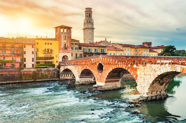 Verona, Italy. Beautiful view of the bridge Ponte di Pietra and ancient buildings on Adige river