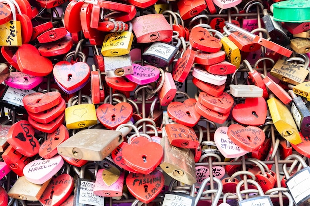 Verona Italy June 2022 background of heartshaped locks on a wall symbol of love forever