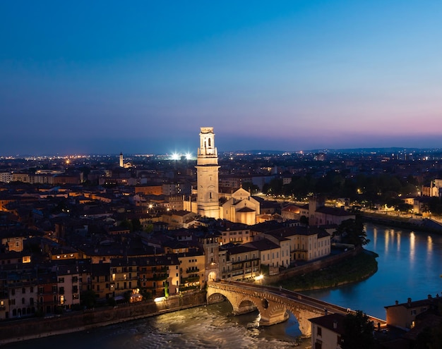 Verona Italy June 2022 panorama by night Illuminated cityscape with scenic bridge