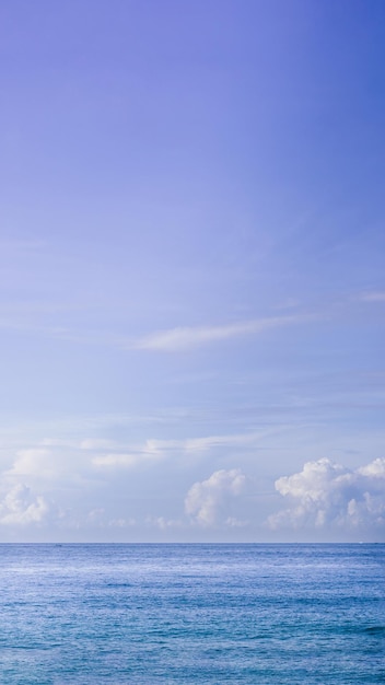 VERTICAL Atmosphere panorama real photo beautiful summer white cloud clear blue PURPLE tone sky horizon line calm sea Concept paradise life Design relax wallpaper background More format in stock