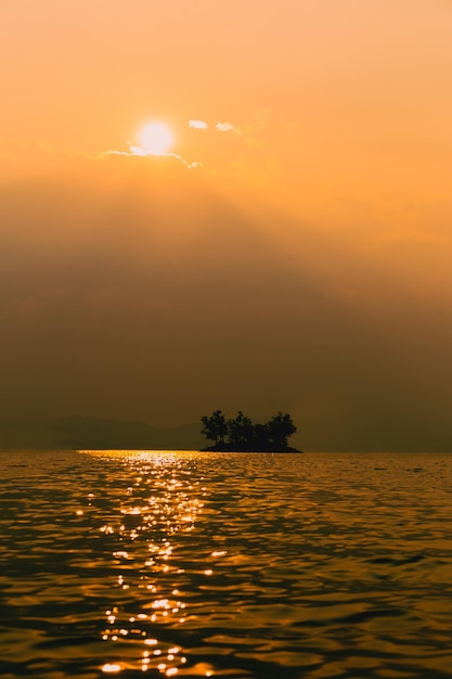 Vertical of beautiful landscape view sunset over the ocean