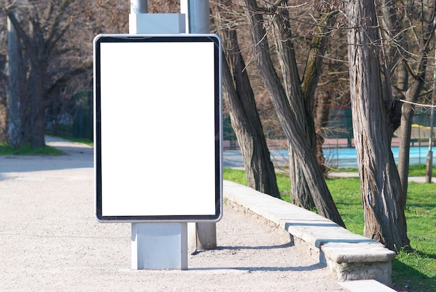 Vertical blank billboard on the city street
