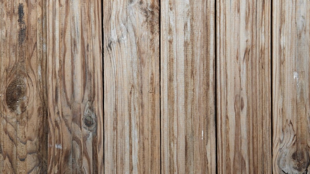 Vertical brown wooden planks. Wood covered in paint and dust. Wooden vintage background