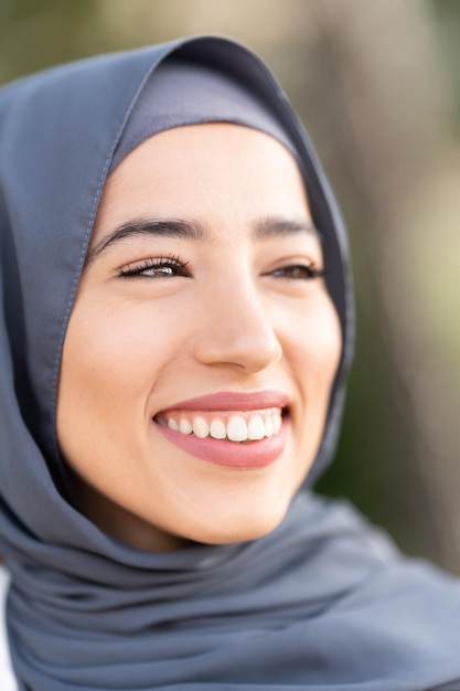 Vertical closeup portrait of an attractive muslim woman