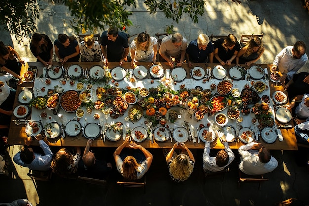 Photo vertical composition of a long table with people celebrating