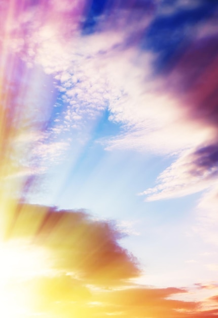 Vertical dramatic cloudscape with sun rays background