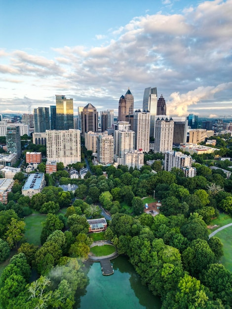 Vertical drone view of the Downtown Atlanta with modern buildings and a large green park Georgia