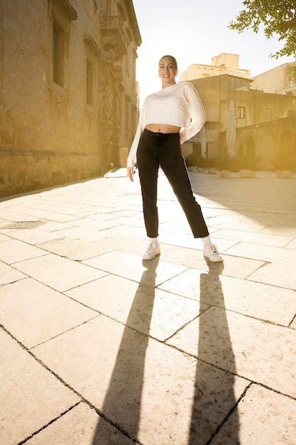 Vertical Full length portrait of woman walking on the street