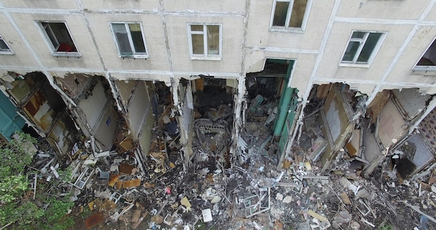 A vertical inspection of a half demolished residential building