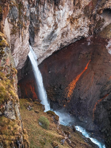 Vertical landscape with beautiful waterfall Autumn waterfall in the JilaSu DjilySu tract KabardinoBalkaria Russia Caucasus Northern Elbrus region